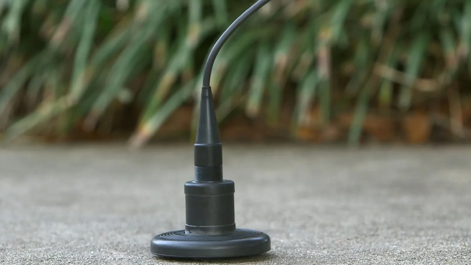 Acoustic leak detection sensor placed on pavement