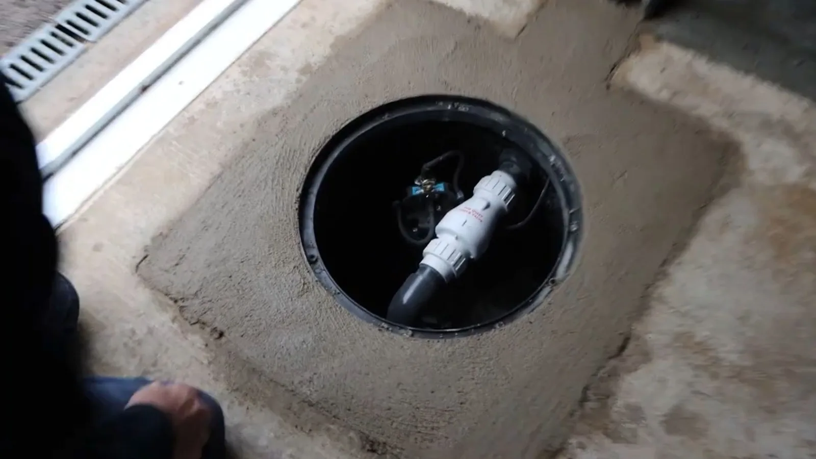 Sump pump installed in a below-floor pit